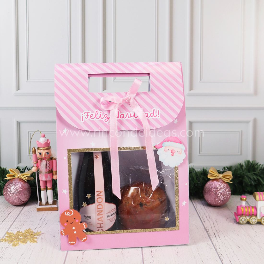 Bolsa con visor rosa a rayas con moño, Papá Noel y galletita de jengibre, con espumante y pan dulce adentro · Masterclass de Navidad 2026