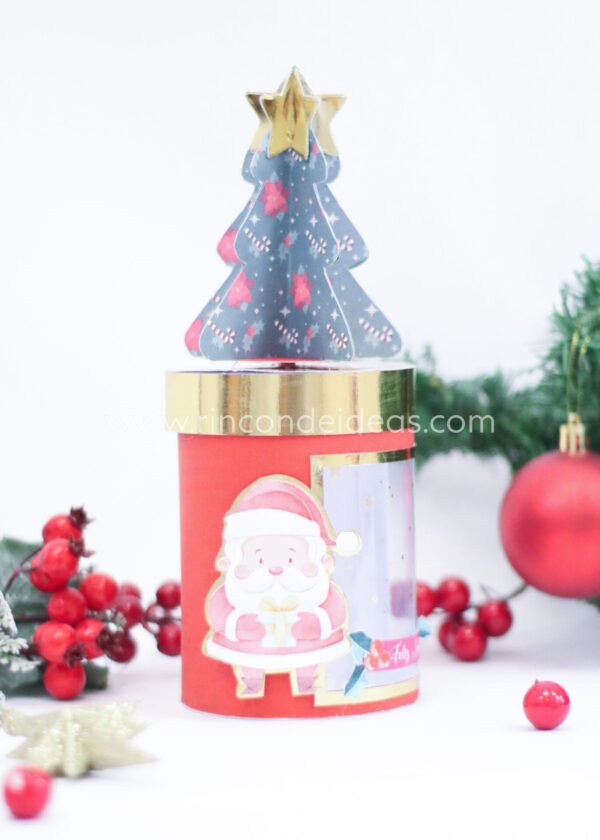 Caja cilíndrica con arbolito de tapa y Papá Noel, de frente · Navidad en Rincón