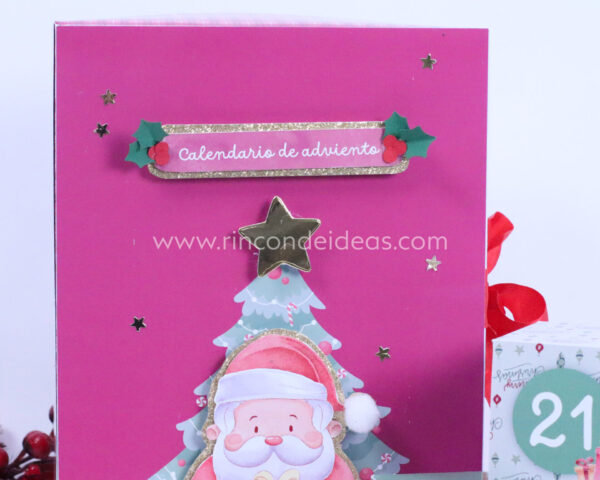 Tapa del calendario con cartel y Papá Noel y estrella dorada · Masterclass de calendarios de adviento, esferas y topper